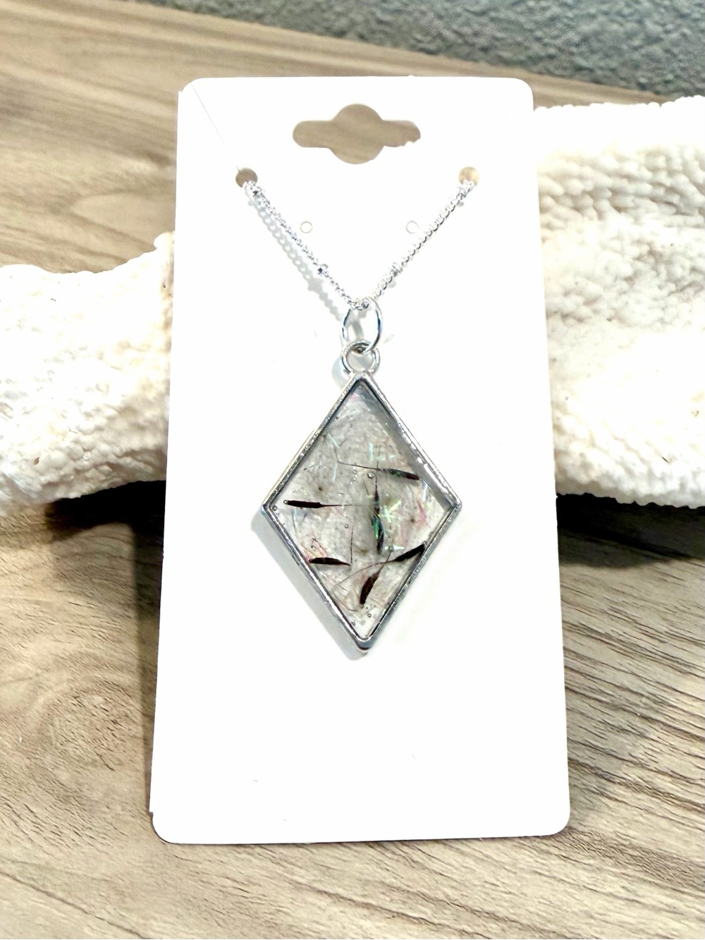 44. Silver Rhombus Necklace with dandelions, glitter, and beach sand